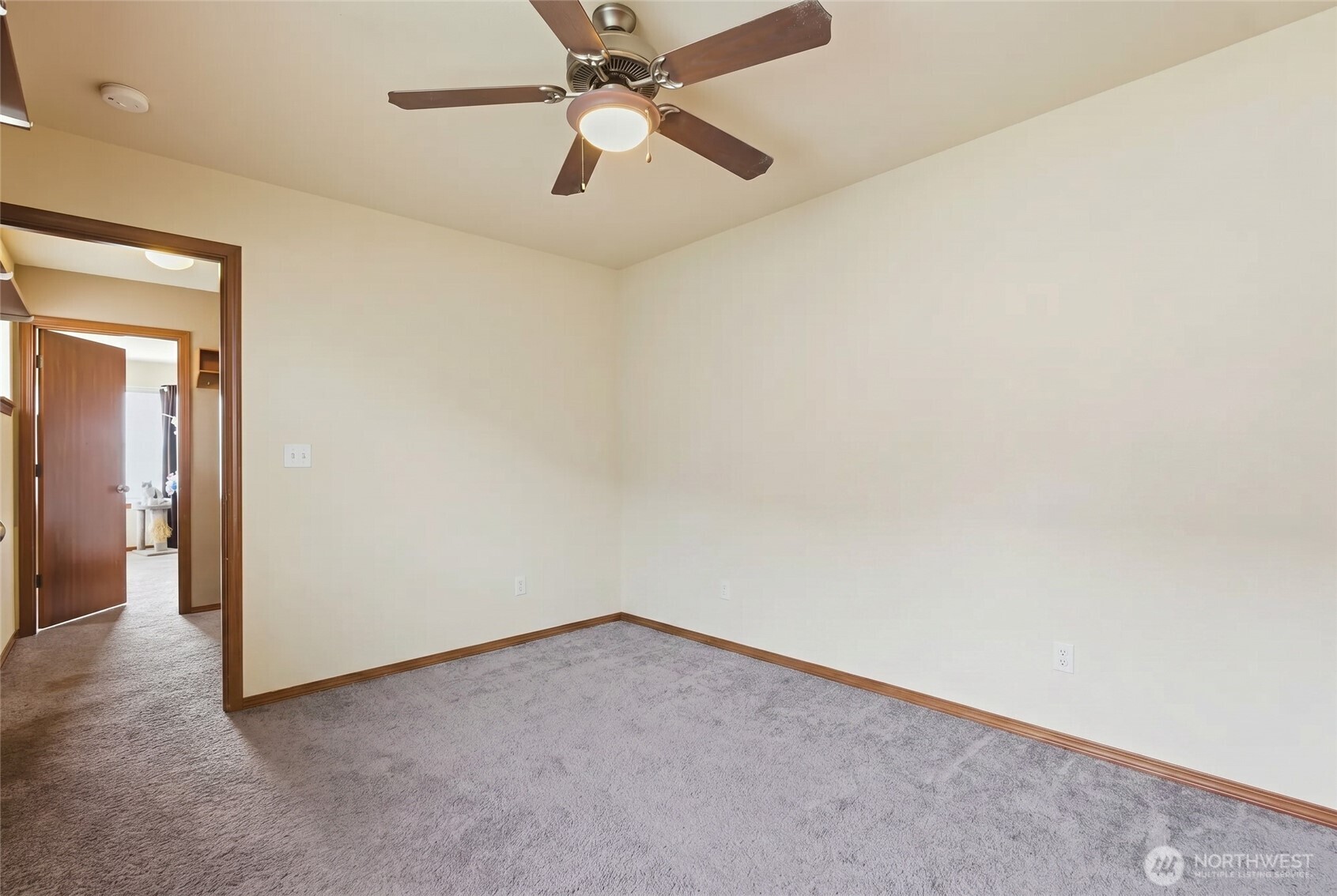 14839 99th Way Southeast Yelm, WA 98597 - Photo 23 of 31 an empty room with a chandelier fan and a ceiling fan
