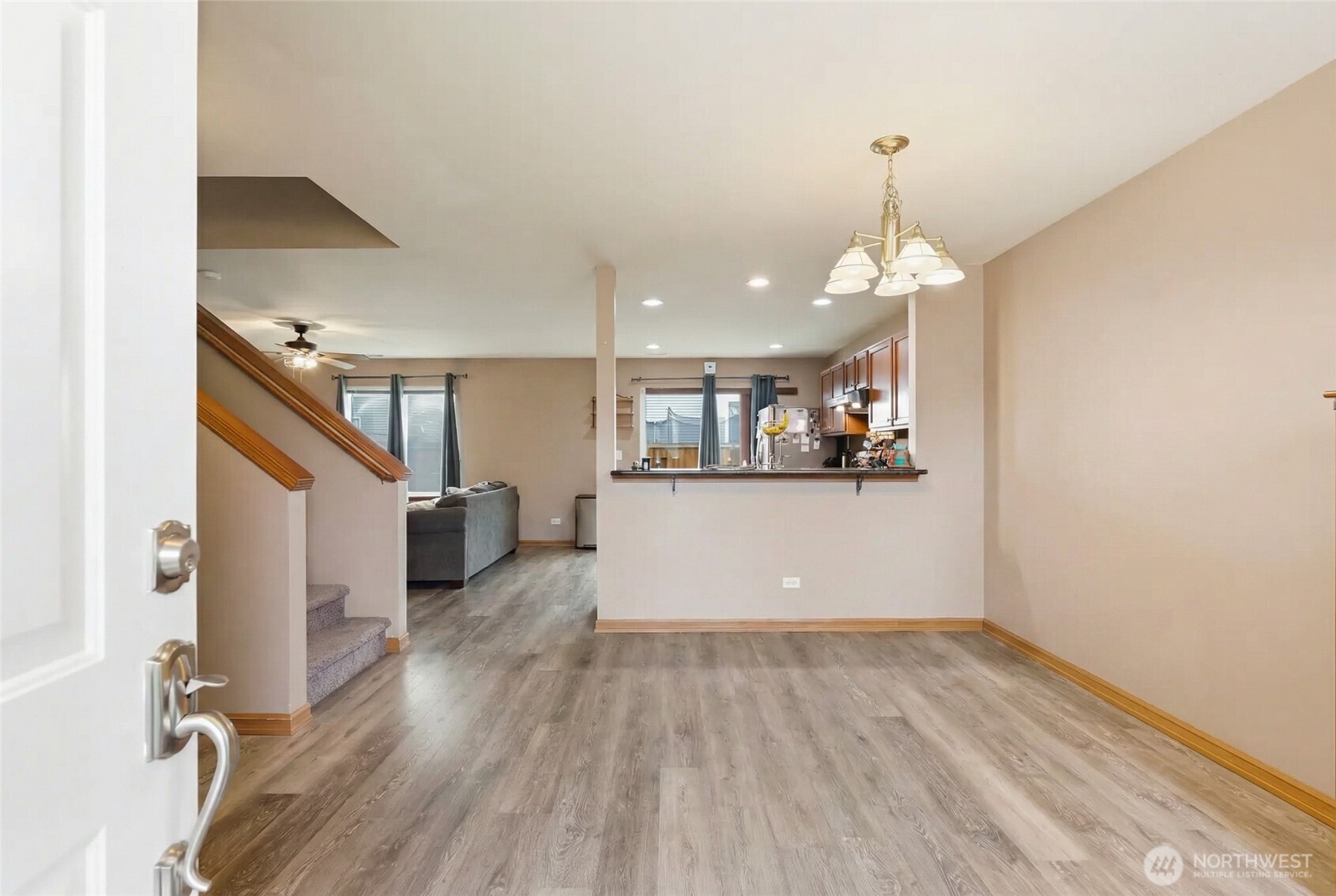 14839 99th Way Southeast Yelm, WA 98597 - Photo 3 of 31 a view of a kitchen and a wooden floor