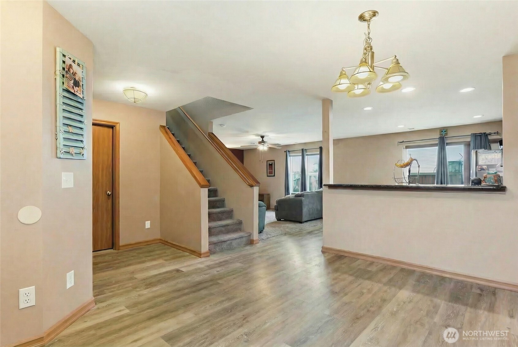 14839 99th Way Southeast Yelm, WA 98597 - Photo 4 of 31 a view of a room with wooden floor and stairs