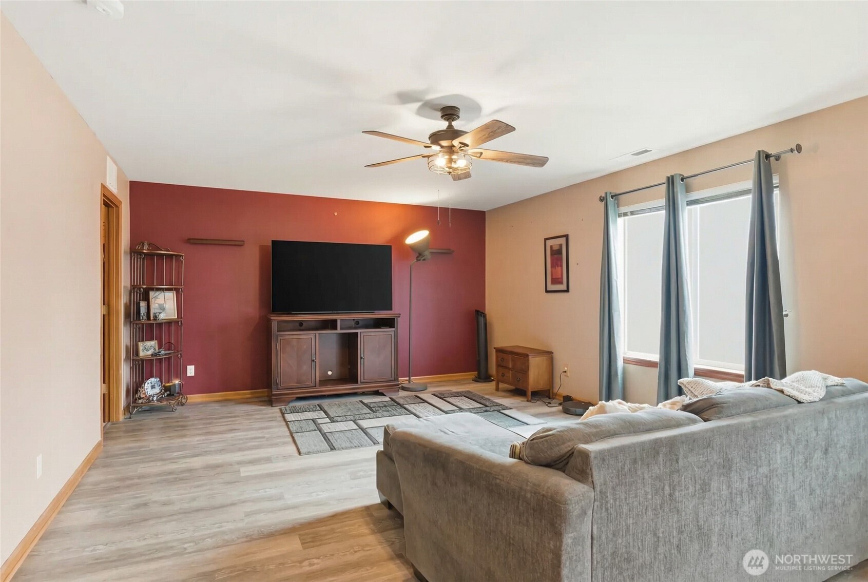 14839 99th Way Southeast Yelm, WA 98597 - Photo 8 of 31 a living room with furniture and a flat screen tv