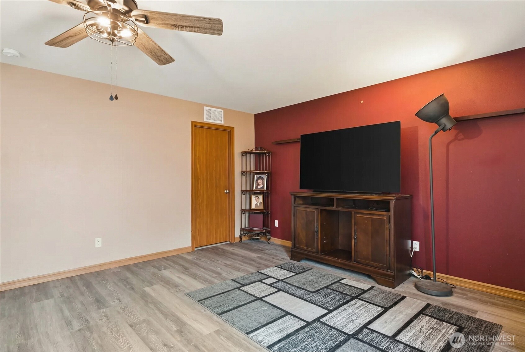 14839 99th Way Southeast Yelm, WA 98597 - Photo 9 of 31 a living room with furniture and a flat screen tv