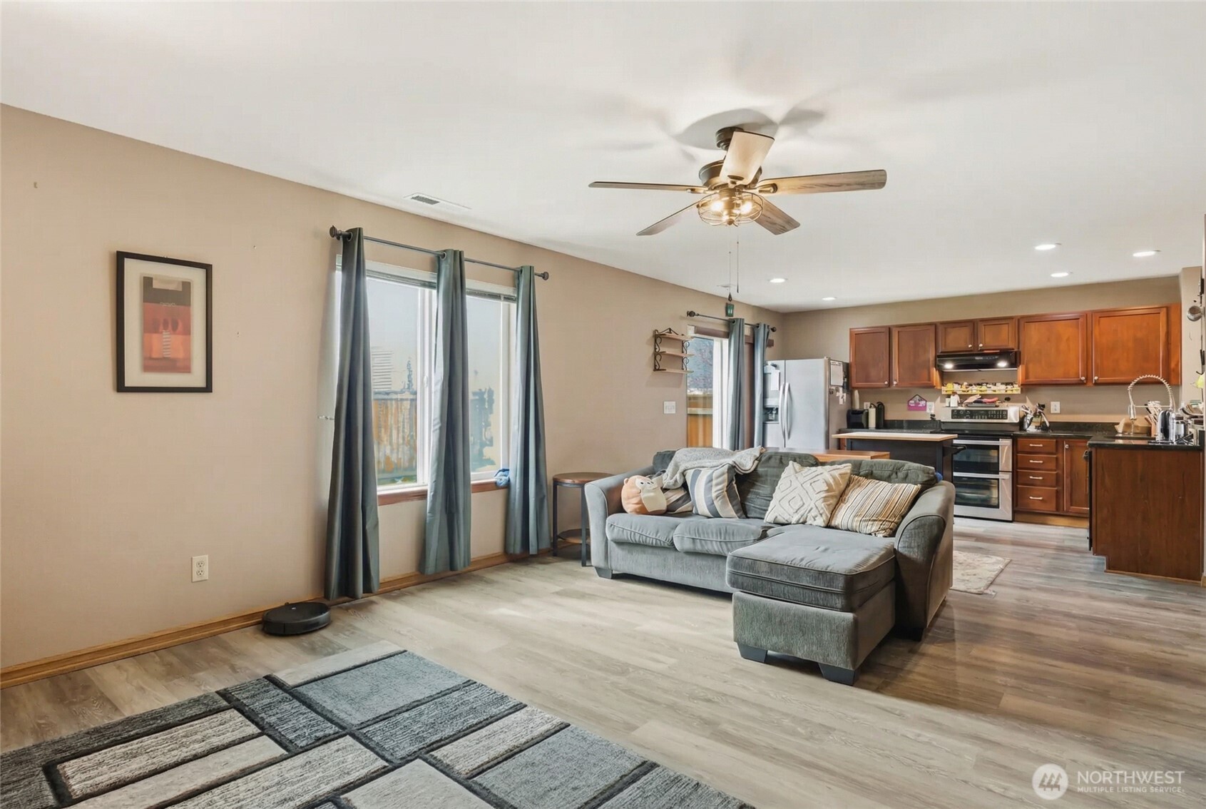 14839 99th Way Southeast Yelm, WA 98597 - Photo 10 of 31 a living room with furniture and kitchen view