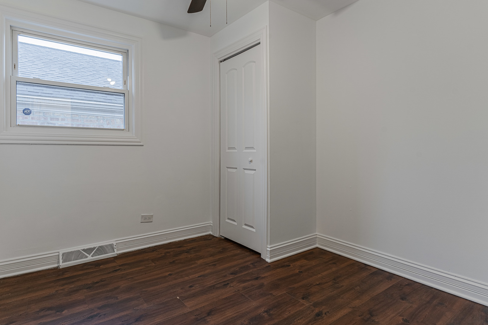10528 South Aberdeen Street Chicago, IL 60643 - Photo 16 of 33 a view of an empty room with wooden floor and a window