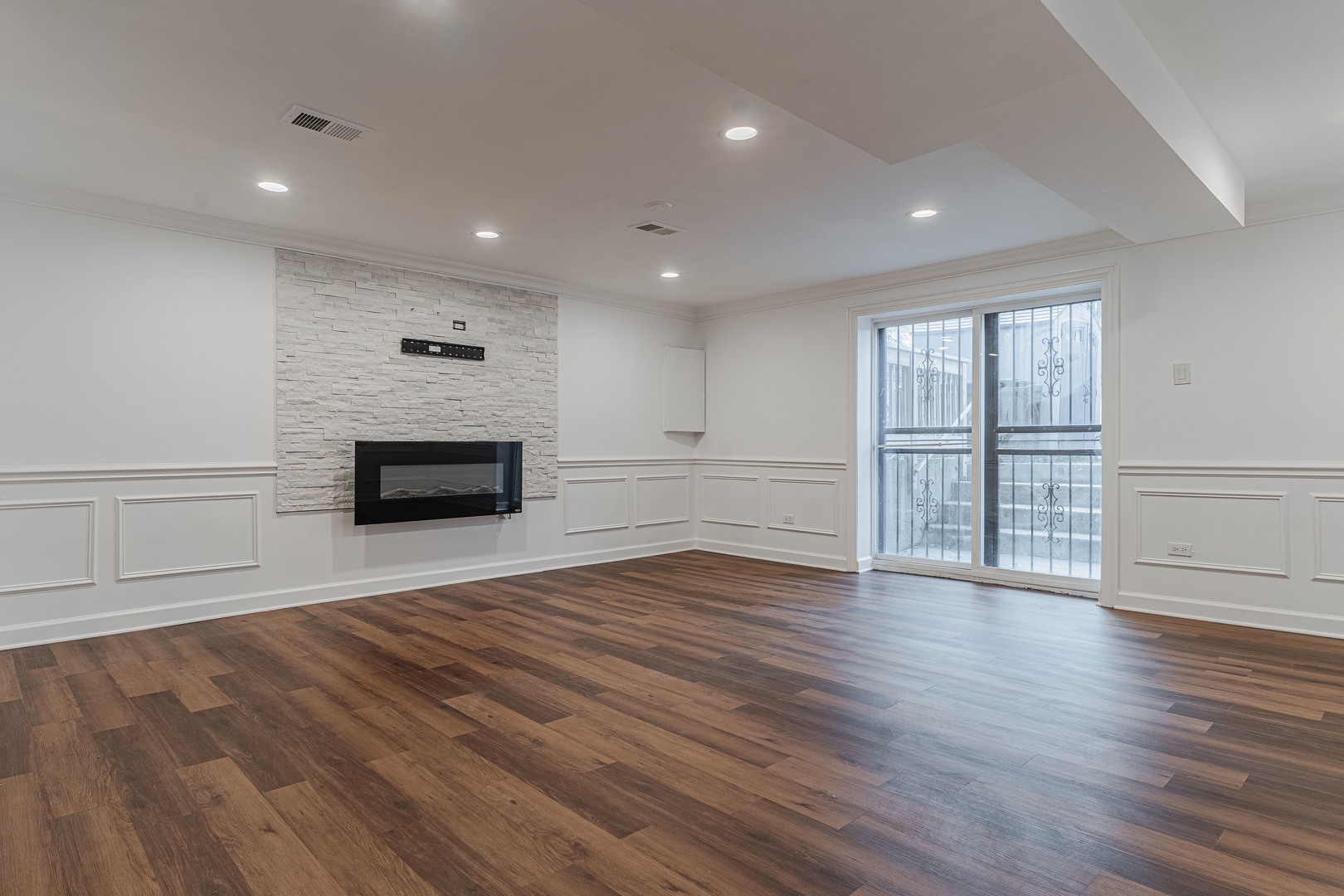 10528 South Aberdeen Street Chicago, IL 60643 - Photo 21 of 33 an empty room with wooden floor and fireplace