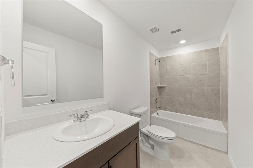 6101 Determine Forney, TX 75126 - Photo 11 of 13 a bathroom with a sink toilet and shower