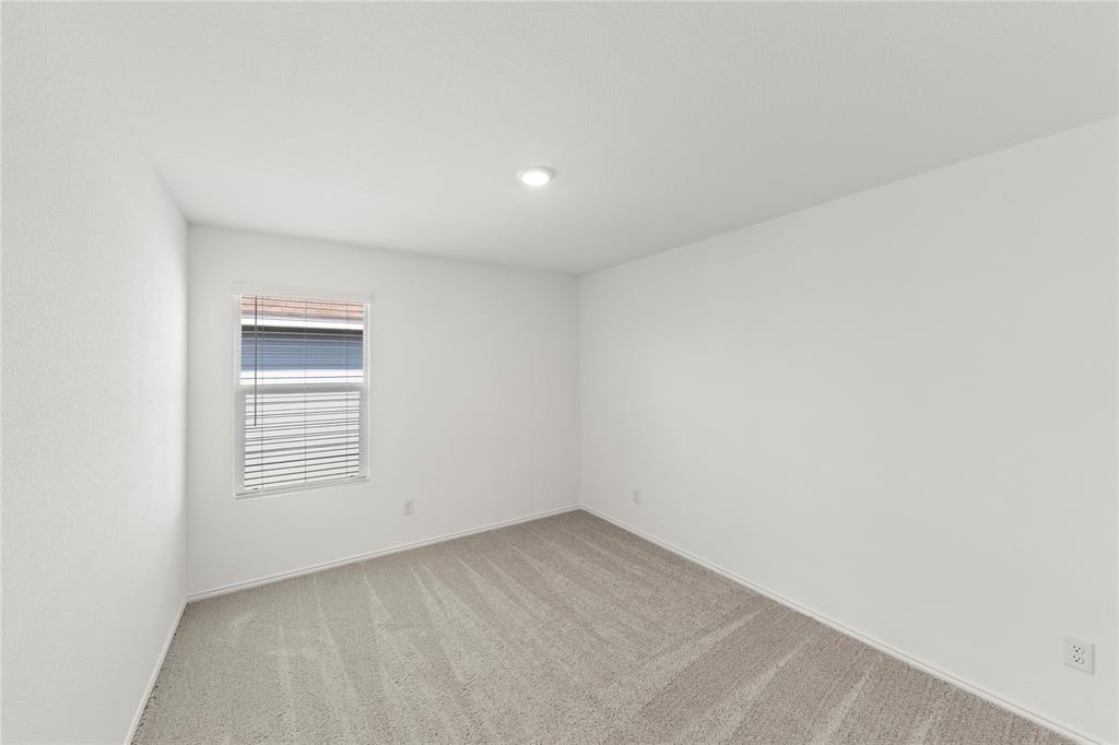 6101 Determine Forney, TX 75126 - Photo 12 of 13 an empty room with windows