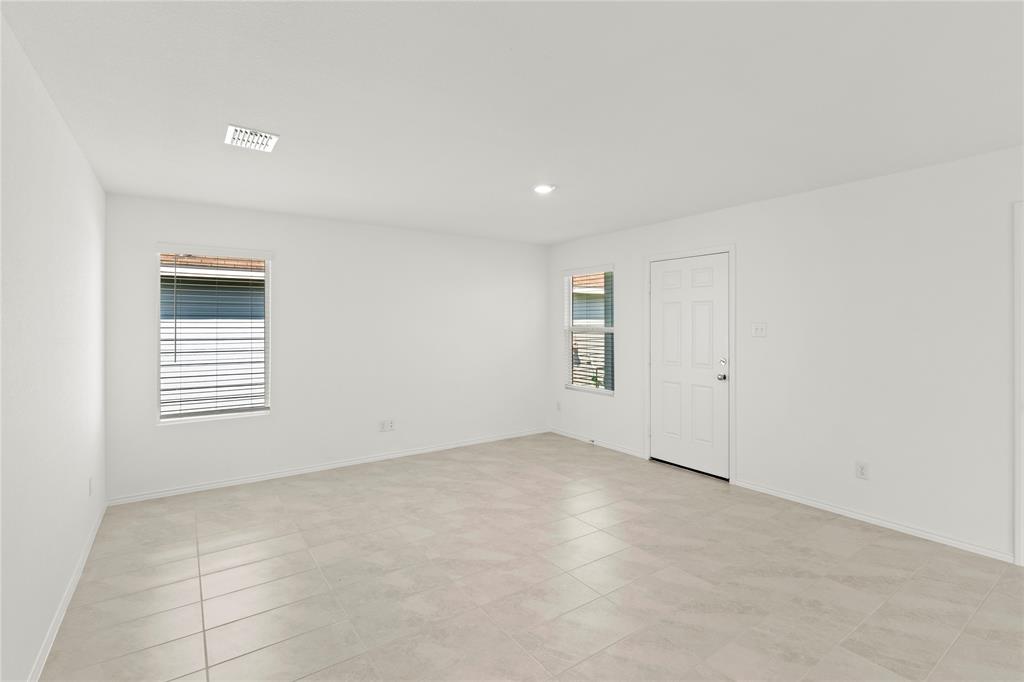 6101 Determine Forney, TX 75126 - Photo 3 of 13 an empty room with windows