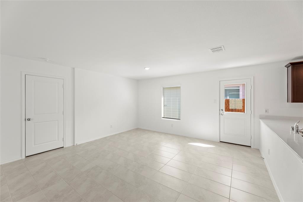 6101 Determine Forney, TX 75126 - Photo 4 of 13 a view of an empty room with a window