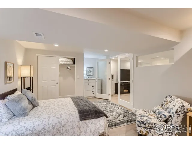 a bedroom with a bed and a bathroom