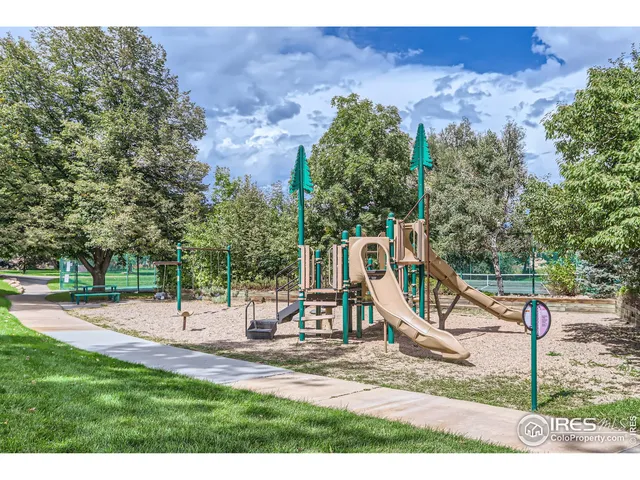 a view of a park with swings
