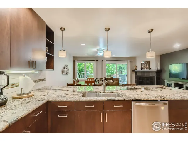 a kitchen with a sink and a wooden cabinets