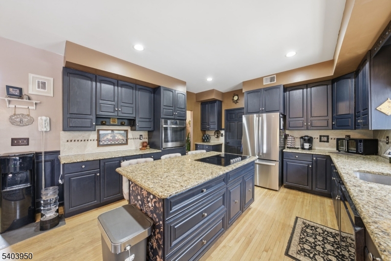 1 Worthington Road Columbia, NJ 07832 - Photo 11 of 50 a kitchen with stainless steel appliances granite countertop wooden cabinets sink and stove