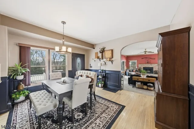 a living room with furniture a window and a table
