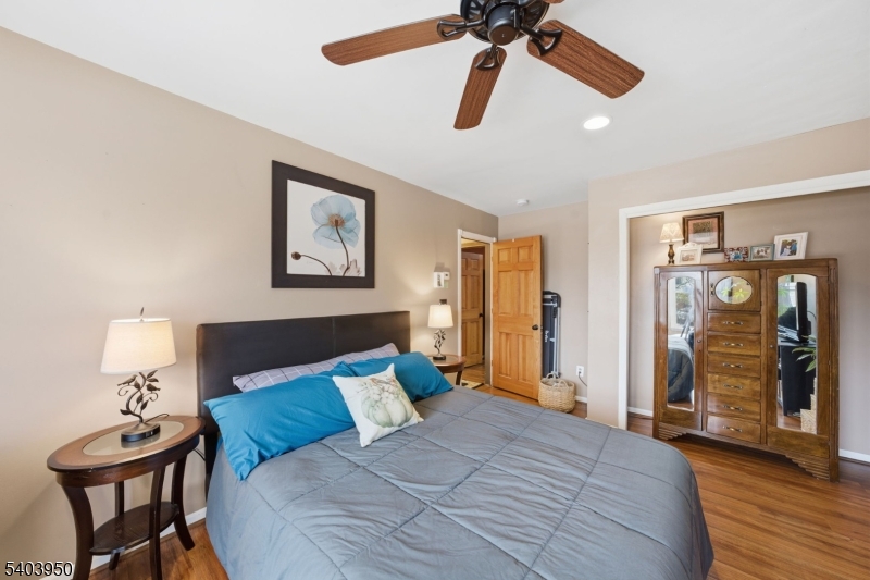 1 Worthington Road Columbia, NJ 07832 - Photo 28 of 50 a bedroom with a bed and a chandelier