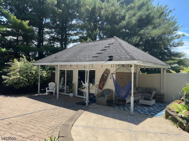 1 Worthington Road Columbia, NJ 07832 - Photo 46 of 50 a view of a house with backyard sitting area and garden