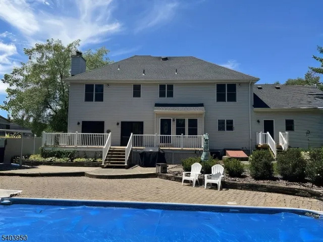a front view of house with yard outdoor seating and barbeque oven