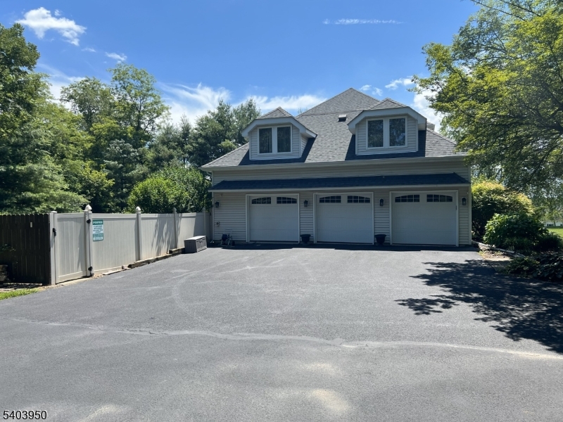 1 Worthington Road Columbia, NJ 07832 - Photo 50 of 50 a front view of a house with a yard and garage