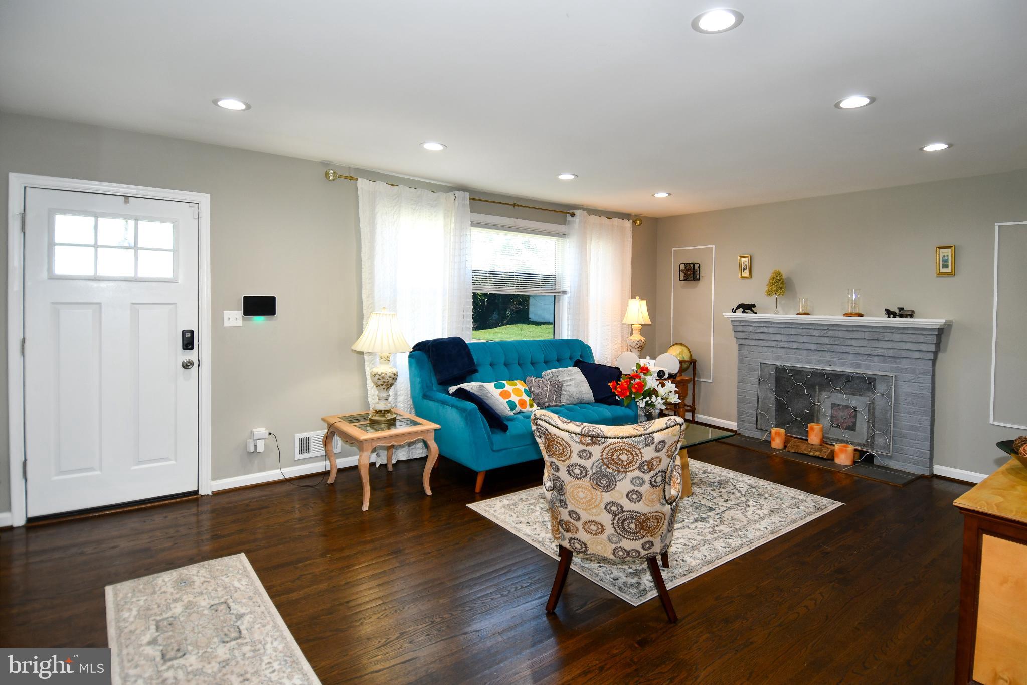 5815 Arbroath Drive Clinton, MD 20735 - Photo 4 of 46 Spacious and bright living room with fireplace.