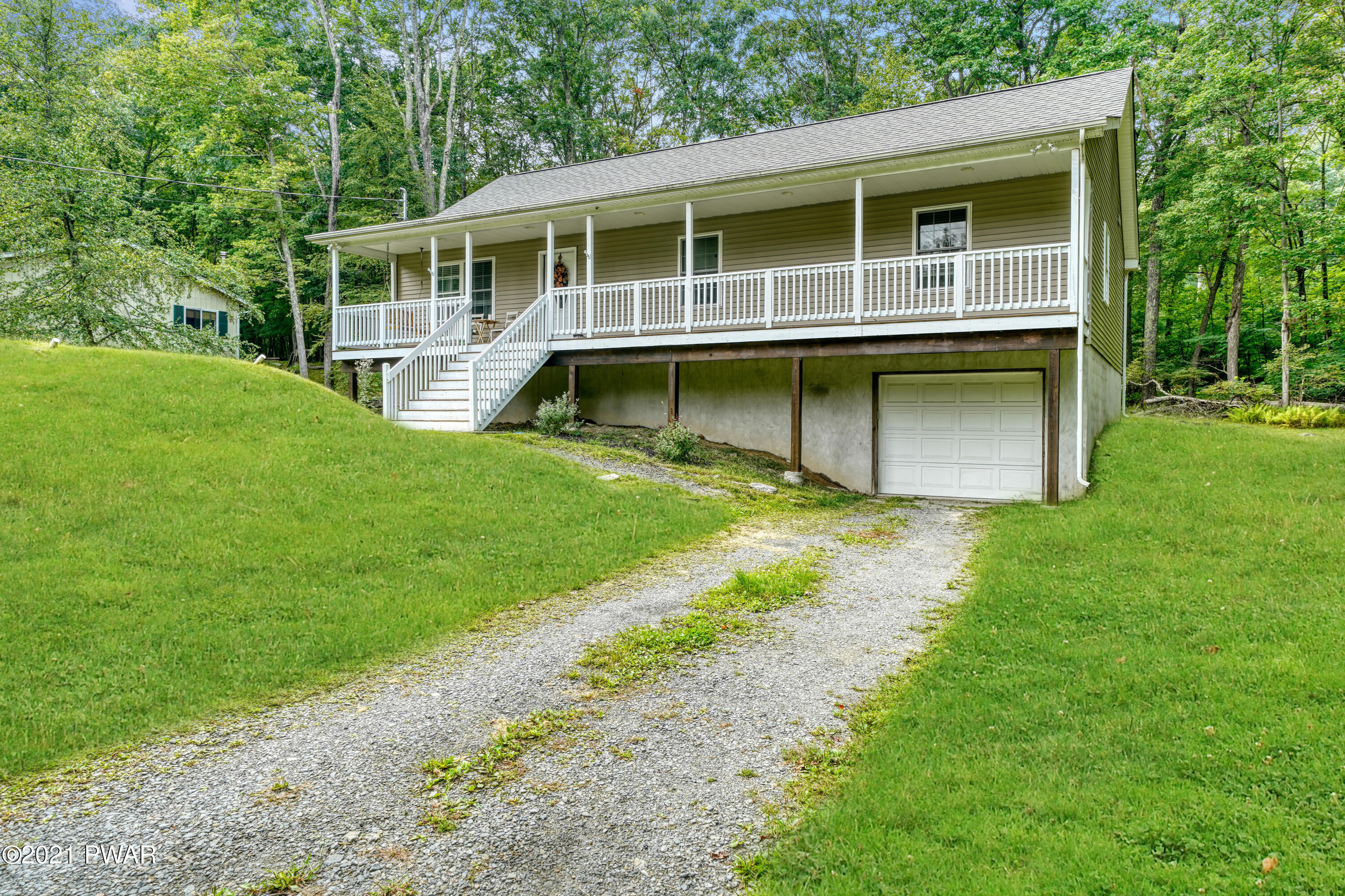 125 Forest Road Dingmans Ferry, PA 18328 - Photo 11 of 28 a house view with a garden space