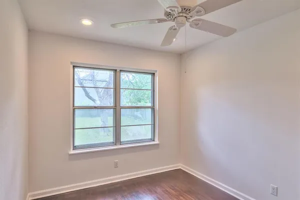 a bathroom with a toilet sink and window