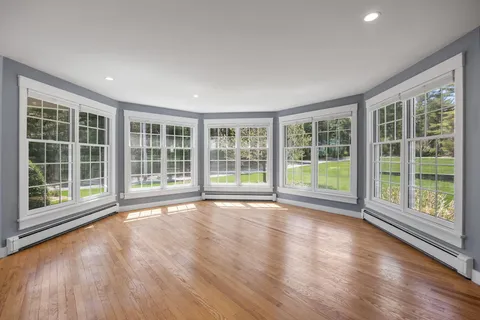 a bathroom with a mirror and a shower