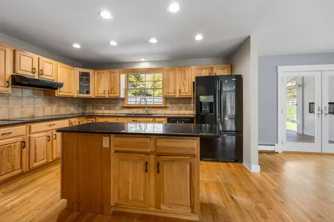 a kitchen with appliances cabinets and a sink