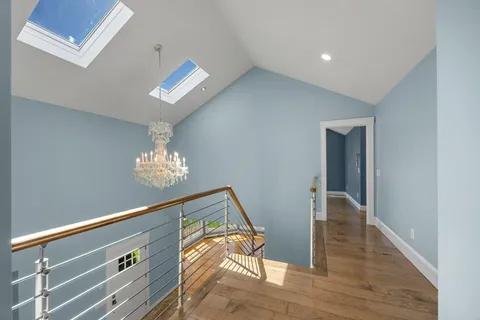 a view of an empty room with stairs