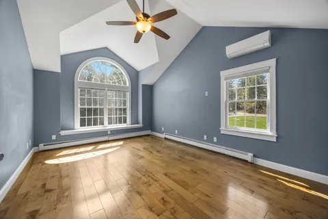 a view of an empty room with wooden wall