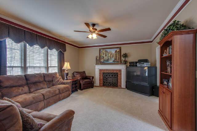 Large, yet cozy den with fireplace...this area opens to kitchen for easy family living and entertaining!