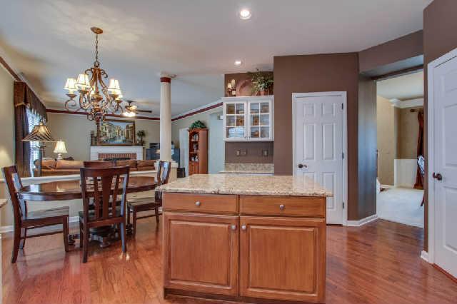 118 Chester Stevens Road Franklin, TN 37067 - Photo 9 of 20 Glass-front cabinets adorn kitchen workspace.