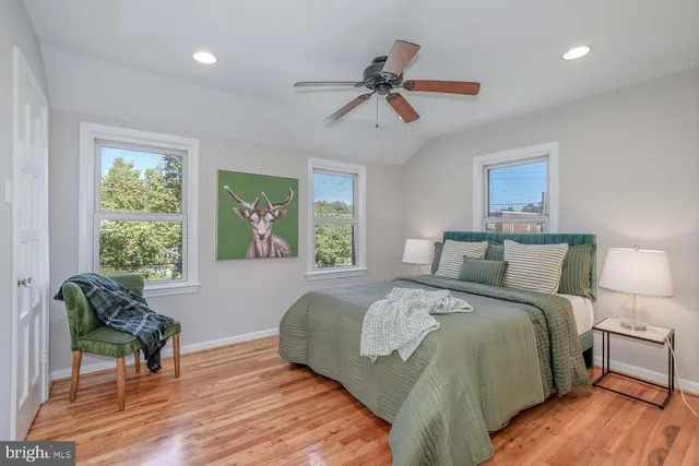 a bed room with a bed and a chair