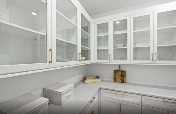 a kitchen with a window and cabinets