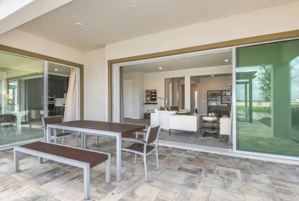 a dining room with furniture and a garden