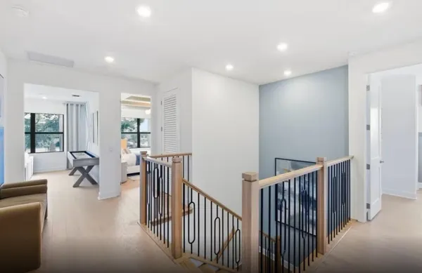 a view of a hallway with seating area