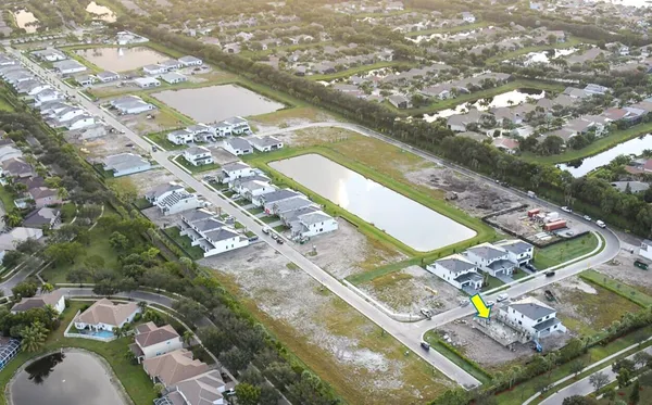 an aerial view of residential houses with outdoor space