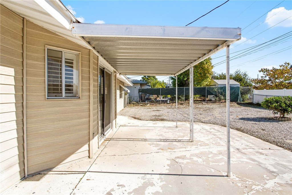 27161 Pinehurst Road Menifee, CA 92586 - Photo 24 of 35 a view of backyard with glass door