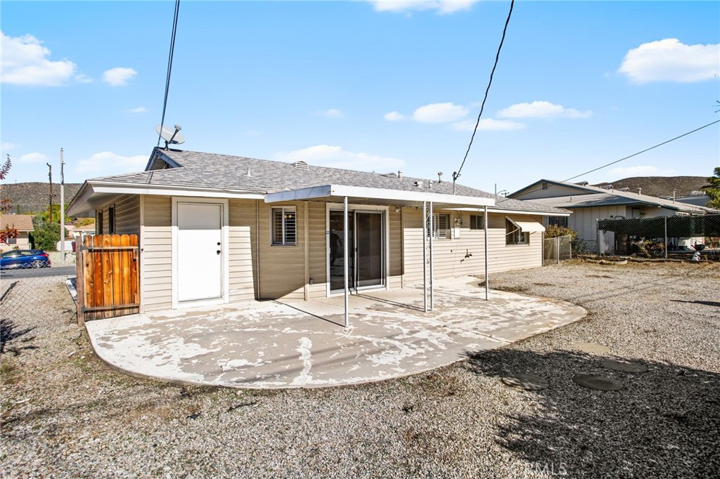 27161 Pinehurst Road Menifee, CA 92586 - Photo 25 of 35 a front view of a house with a garden