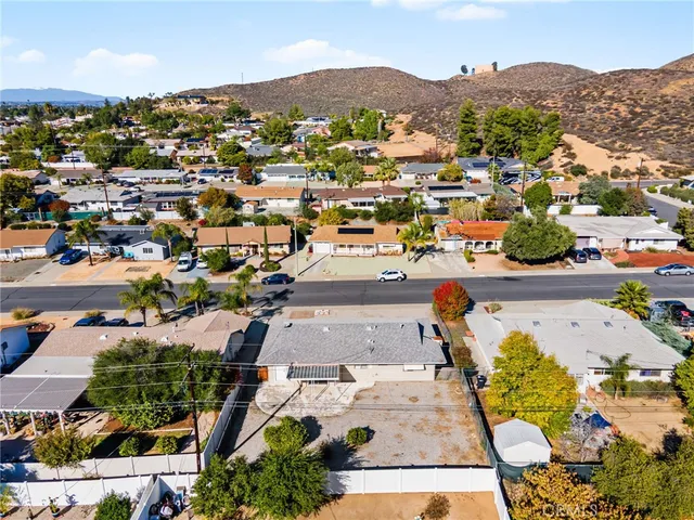 an aerial view of residential houses with outdoor space