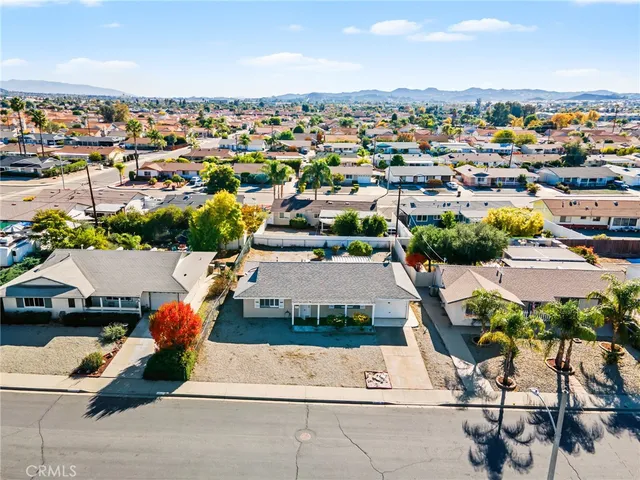 an aerial view of a building with parking