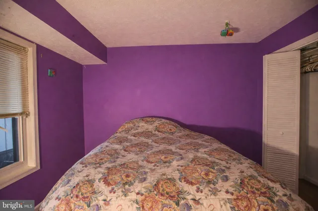 a bathroom with a sink shower and a mirror
