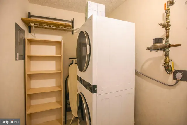 a view of a chairs and table in the balcony