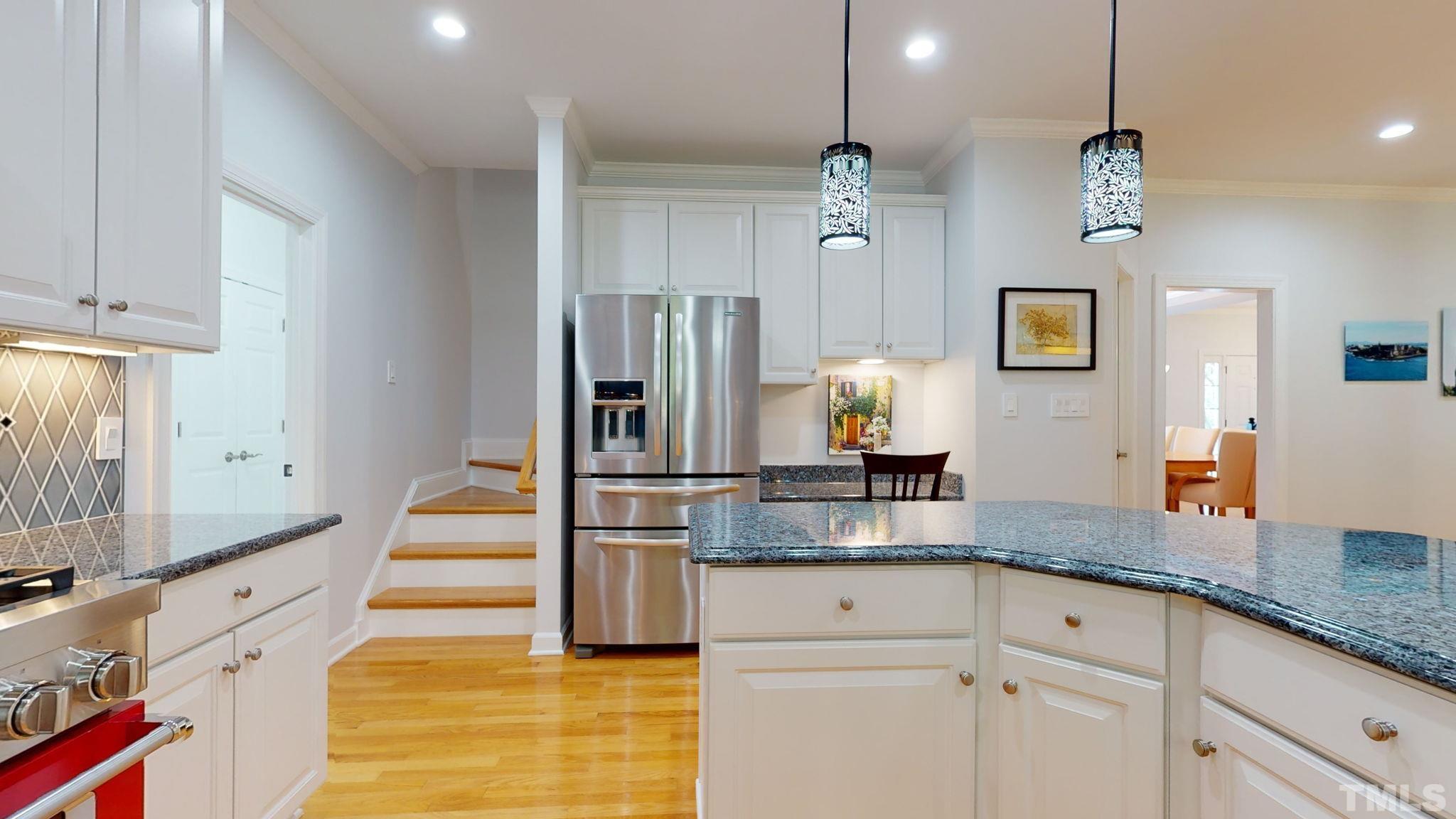 1512 Wood Spring Court Raleigh, NC 27614 - Photo 19 of 39 a large kitchen with cabinets
