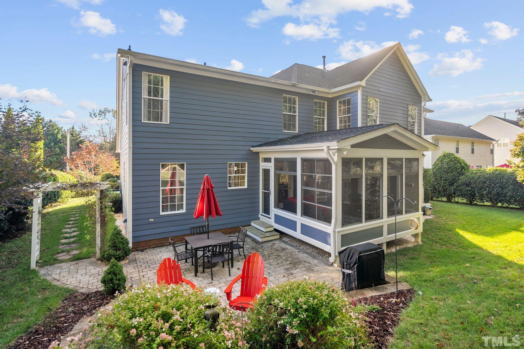 1512 Wood Spring Court Raleigh, NC 27614 - Photo 33 of 39 a view of a house with a yard and potted plants