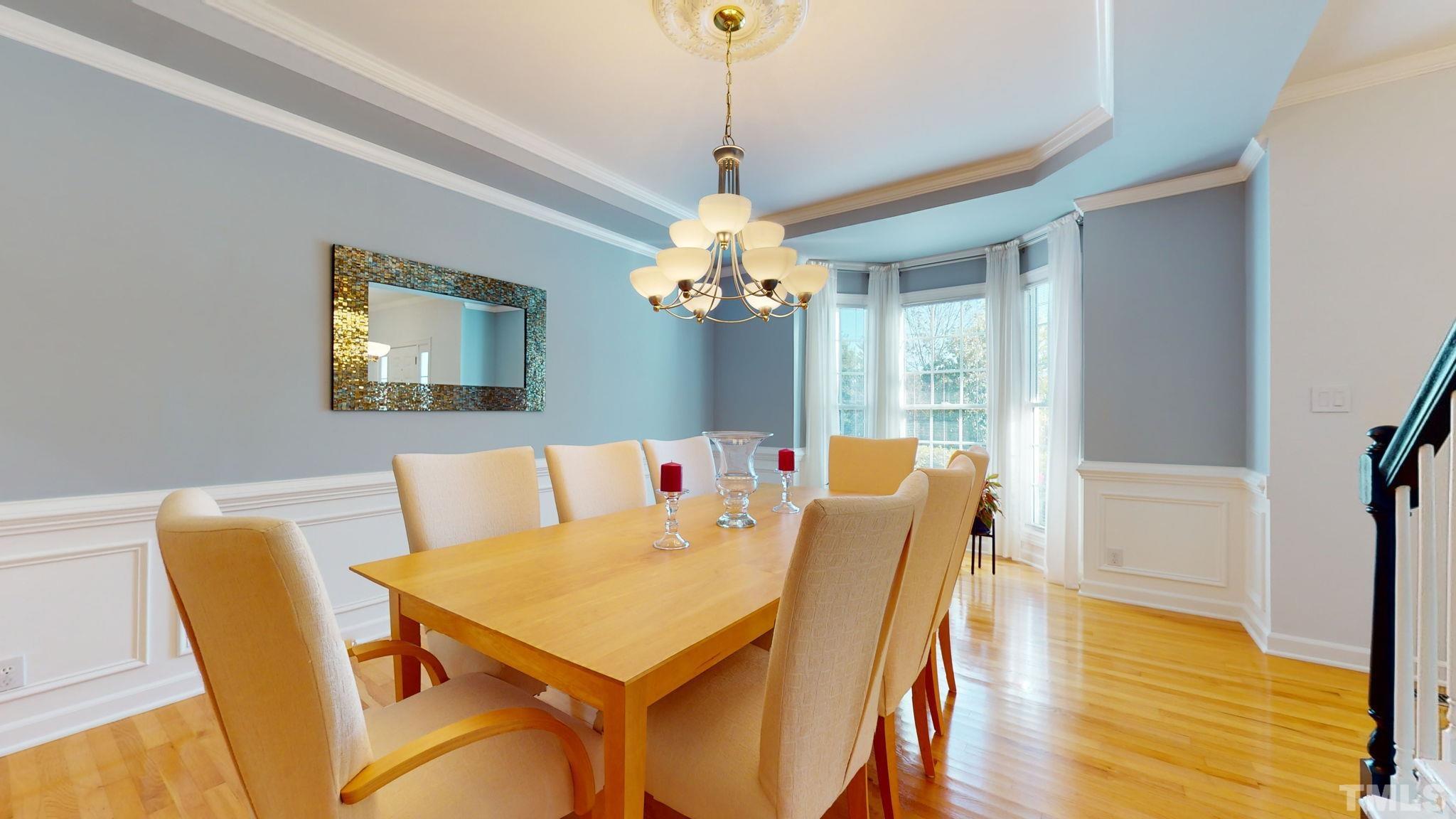 1512 Wood Spring Court Raleigh, NC 27614 - Photo 9 of 39 a view of a dining room with furniture and wooden floor