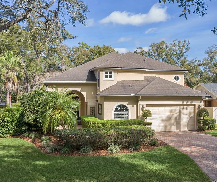 1320 Ridge Road Longwood, FL 32750 - Photo 1 of 1 Stately elevation with lush landscaping