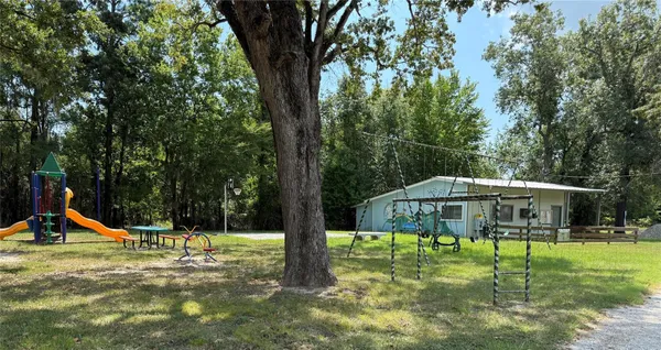 a view of a table and chairs in the patio
