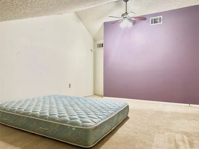 a view of a livingroom with a ceiling fan