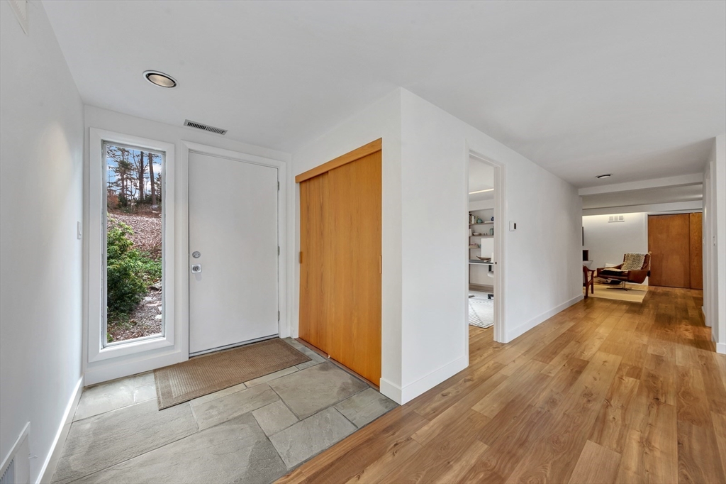 85 The Valley Road Concord, MA 01742 - Photo 38 of 38 a view of a living room hardwood floor and a window