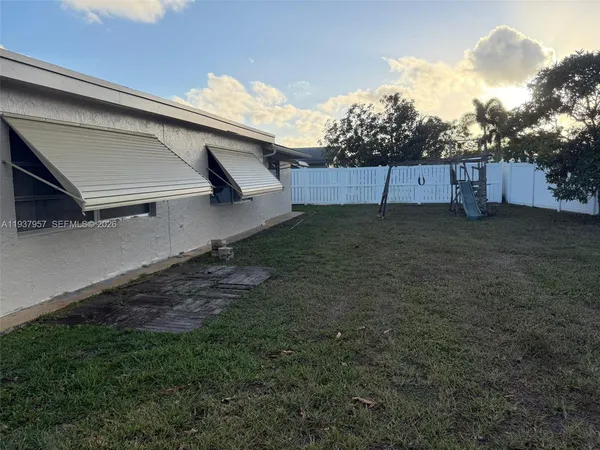 a view of outdoor space and yard