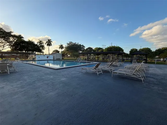 a view of a swimming pool and outdoor space